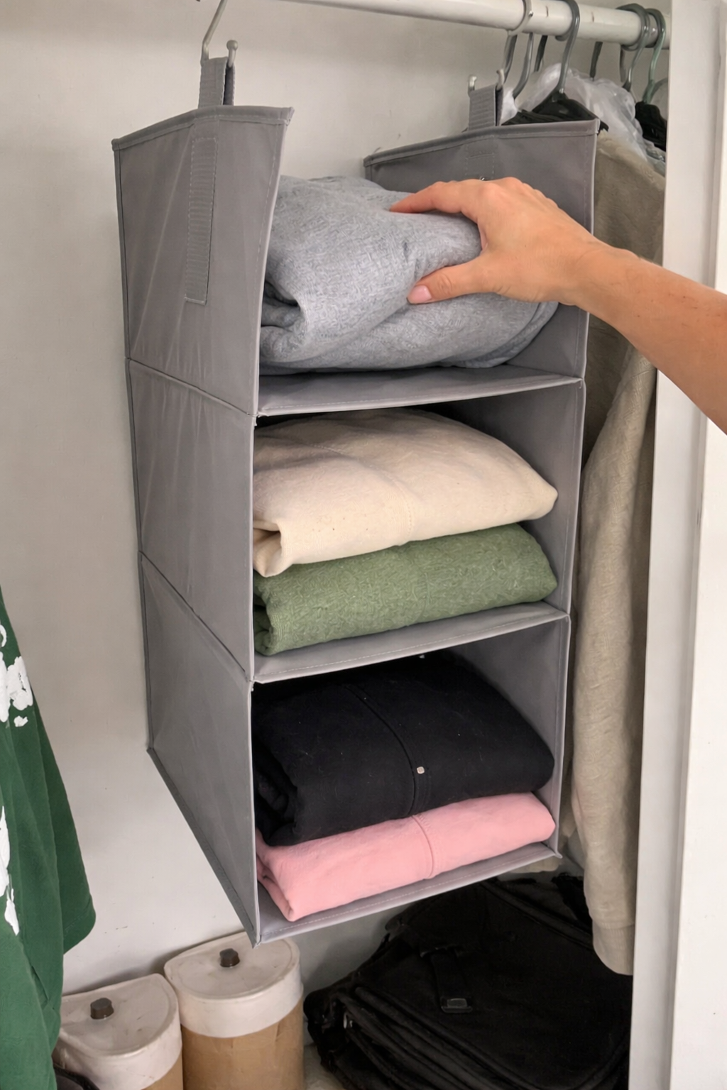 Heavy duty hanging closet organizer holding hoodies and jeans